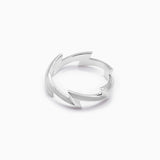 Silver lighting bolt ring on a white background