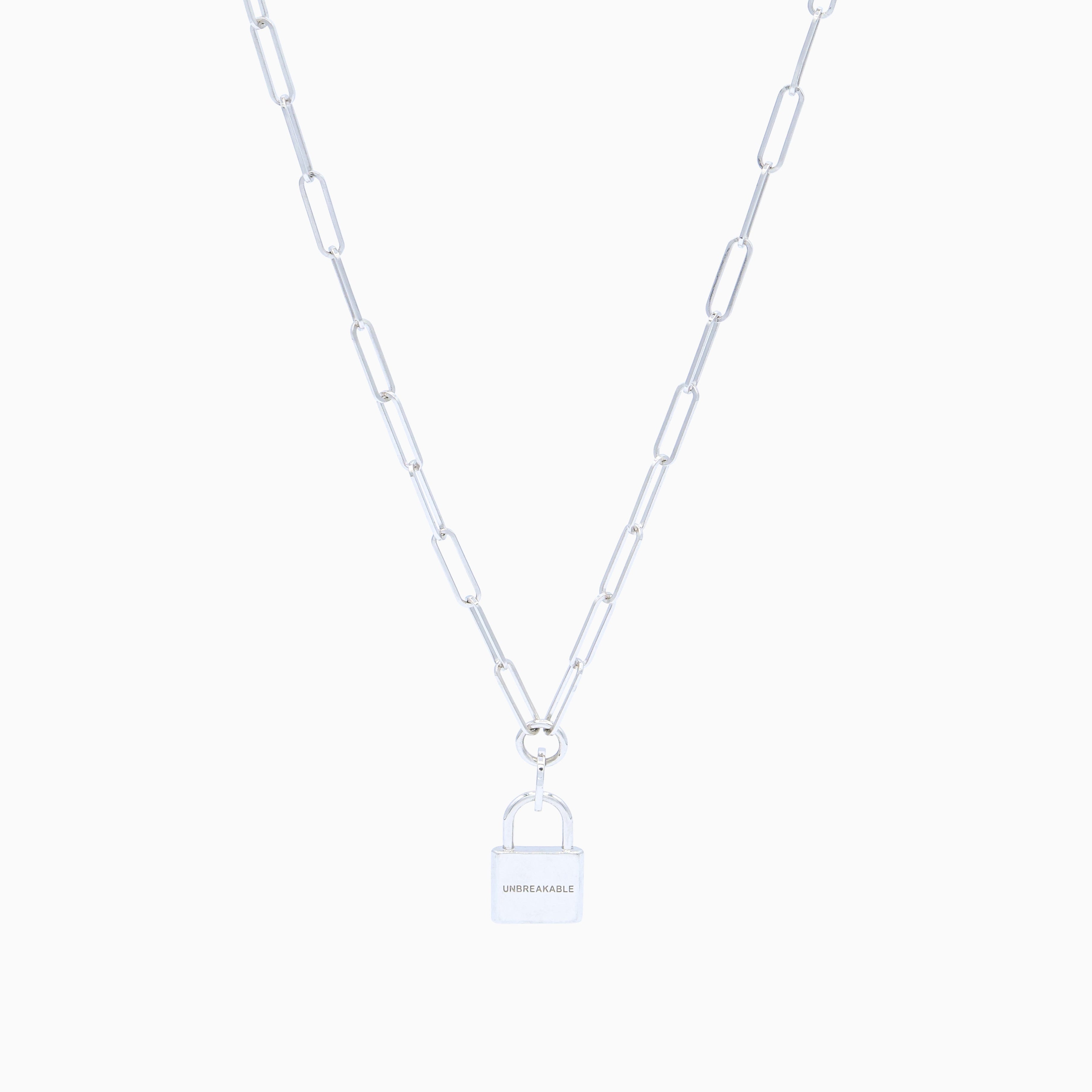 Silver chain link necklace with padlock on cream background