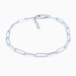 Silver chain link bracelet on a white background