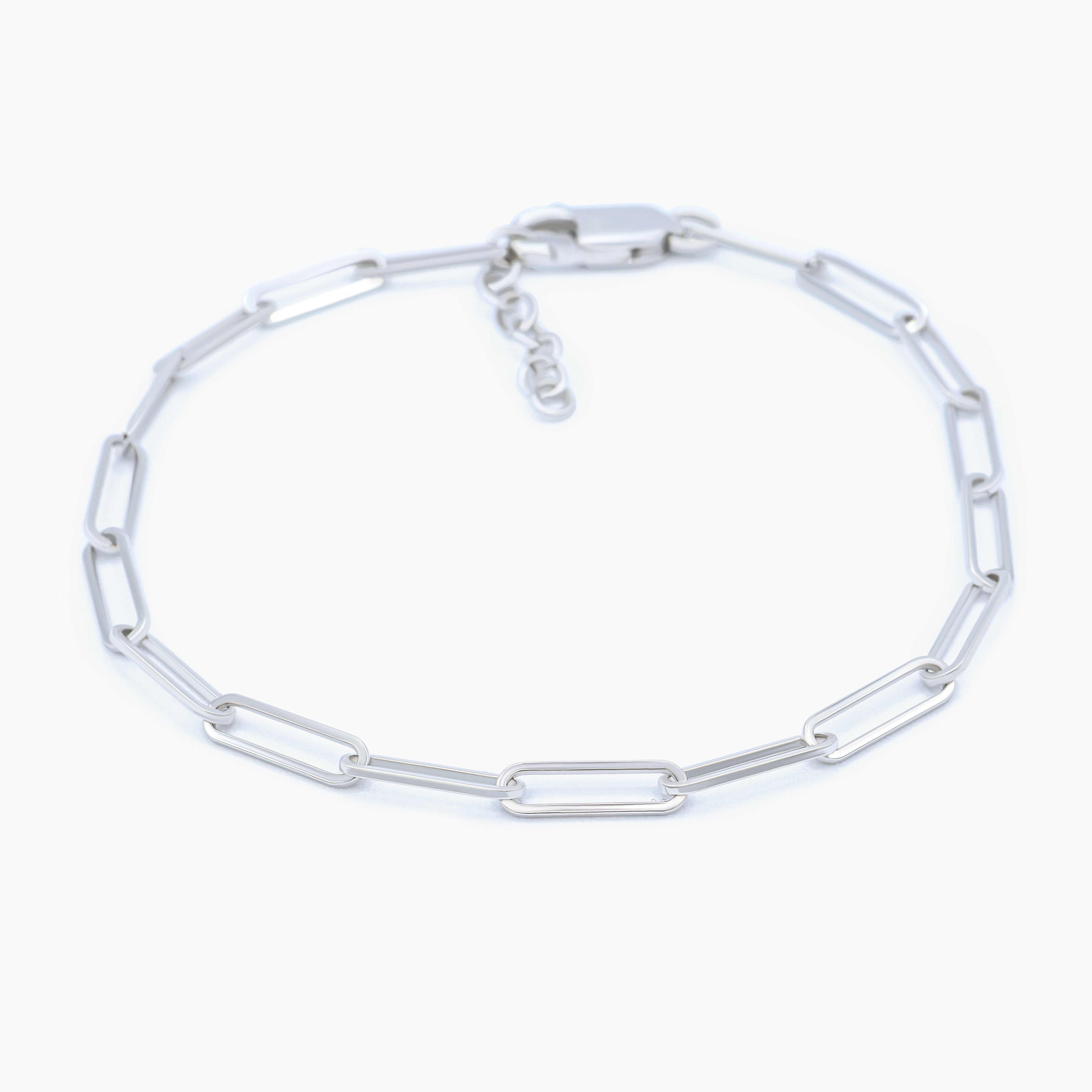 Silver chain link bracelet on a white background
