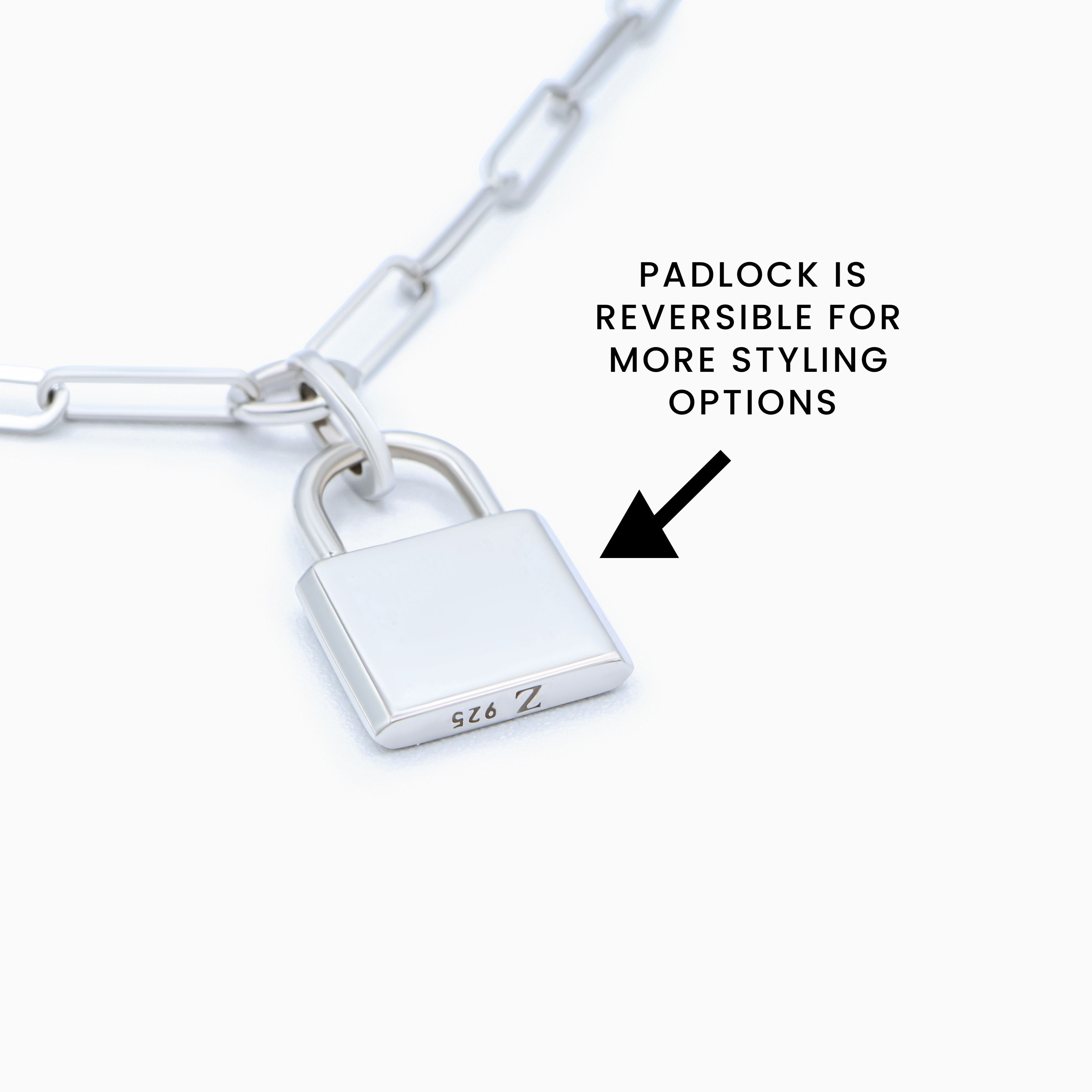 Reversible padlock on a white chain with text indicating reversibility.