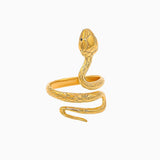 Gold snake-shaped ring on a white background